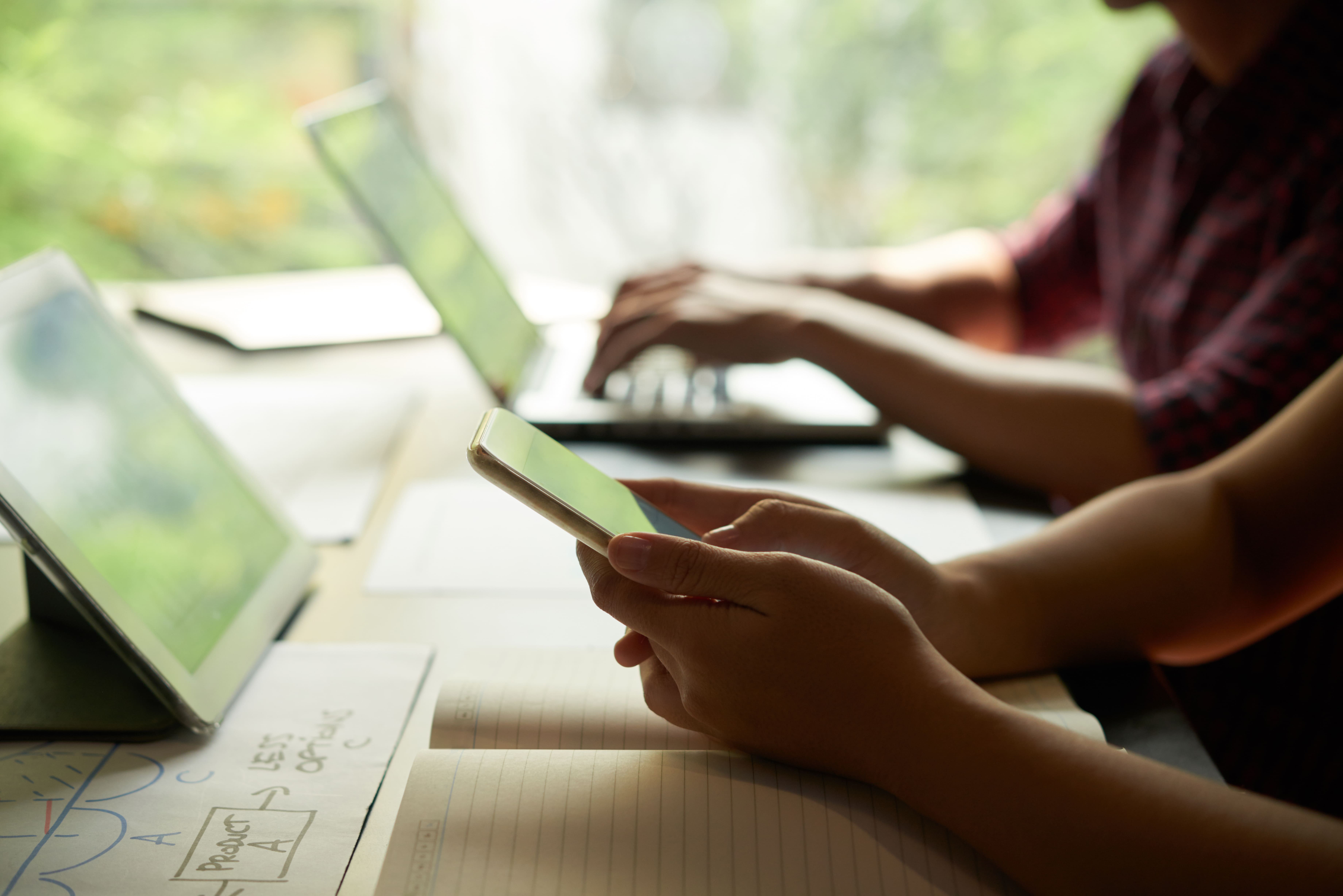 Professional analyzing data on laptop