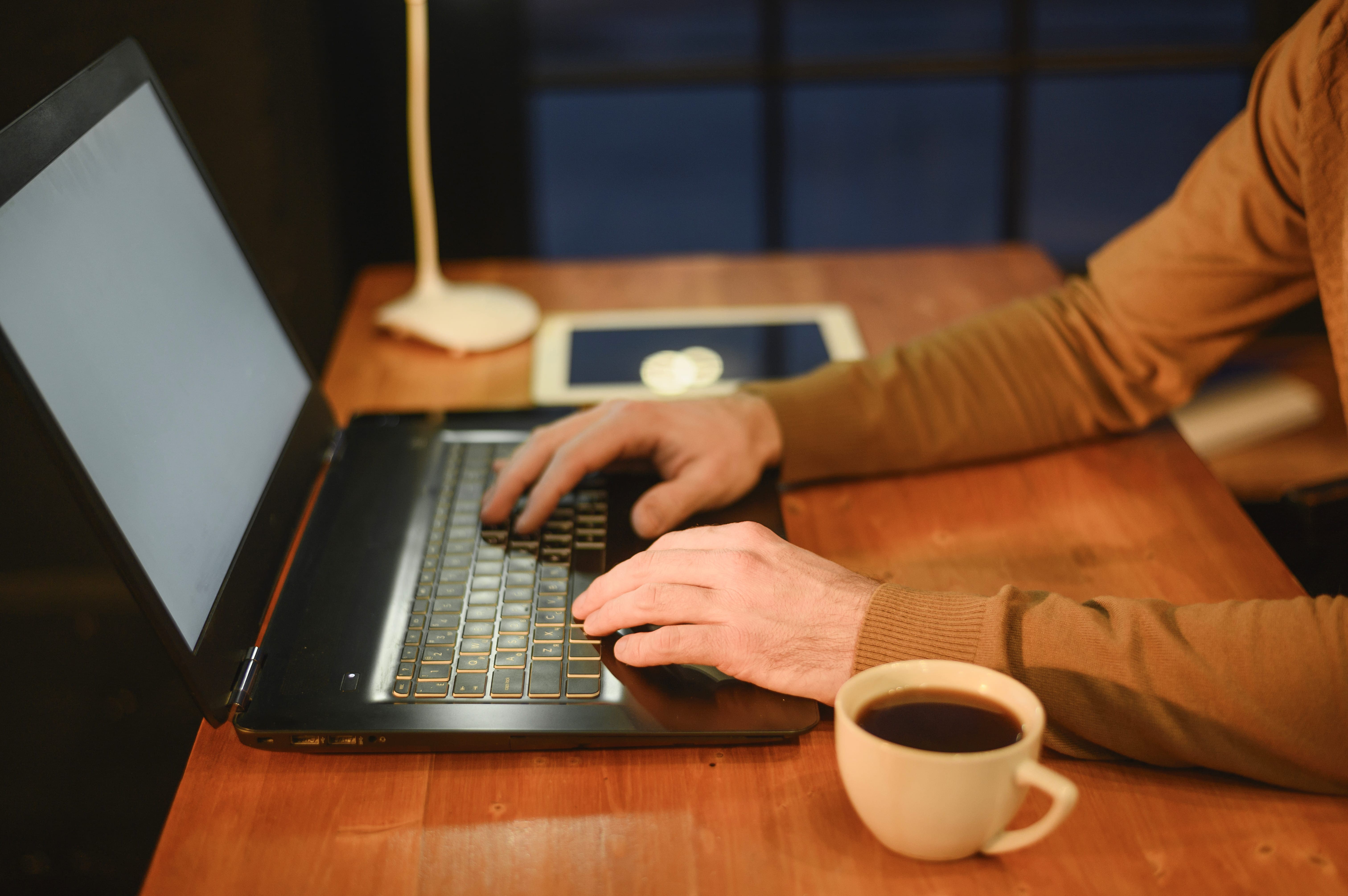Professional working on laptop in office